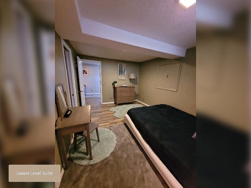 Lower Level Suite Sleeping Area - Enough open floor space for working out or yoga!
