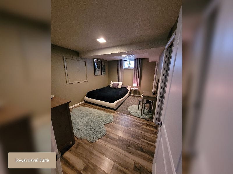 Lower Level Suite - Queen Platform Bed with Room Darkening Curtains