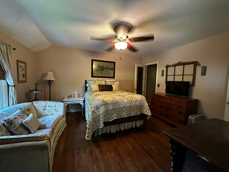 Welcome Home! Full, comfy, high bed making you feel like you're sleeping on clouds! End tables, overhead ceiling fan, a Smart TV and more!!
