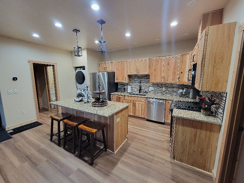 View of kitchen from front door.  Bedrooms are to the right.