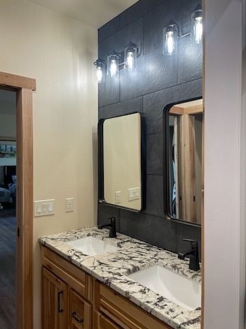 Bathroom vanity area.  Access to the garage is through this area.