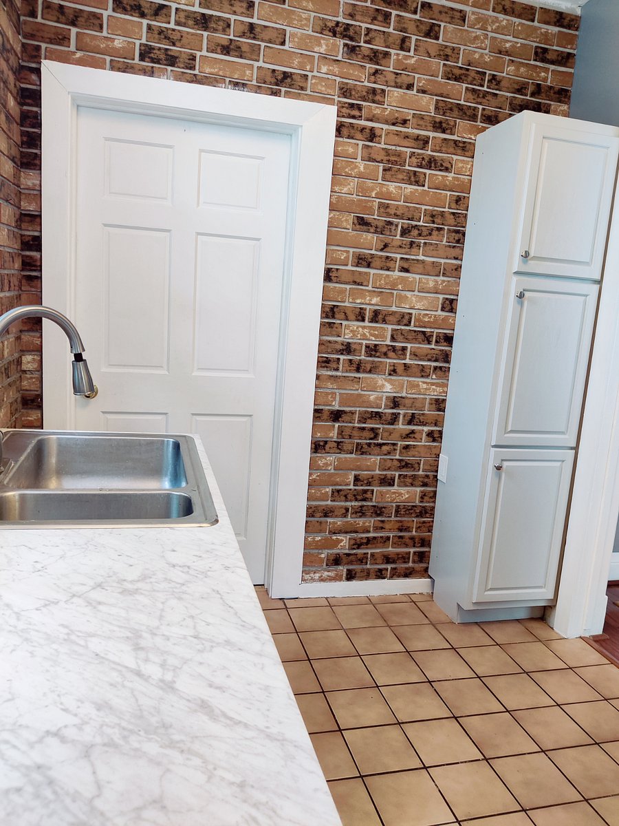 first floor apartment kitchen exposed brick feature