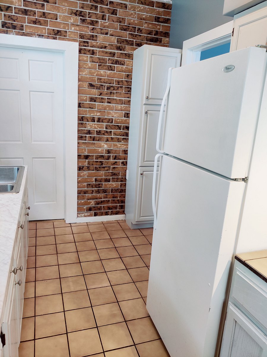first floor apartment kitchen exposed brick feature