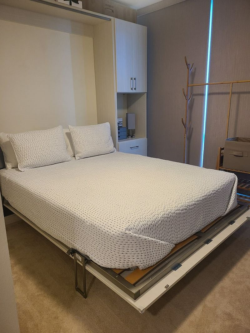 This is the Queen Murphy Bed when it's pulled down. Comes with Brooklinen sheets, pillows and quilted comforter.