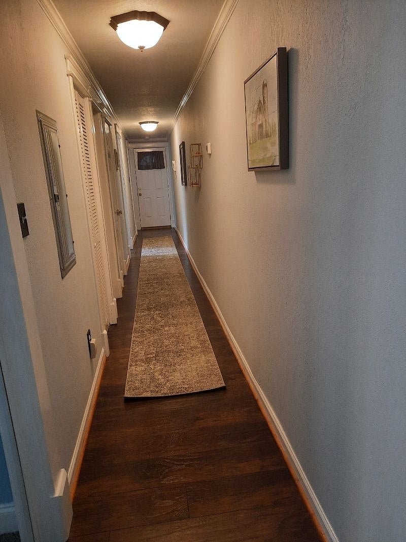 No, that's not a phone on the wall, lol! That's the receiver to the front door intercom so you can buzz in Door Dash or whom ever