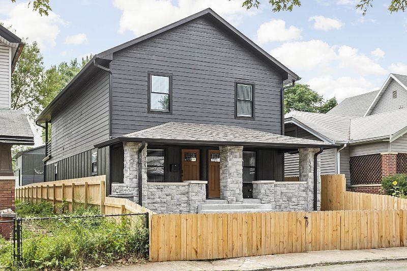 The exterior of the home, also fenced for added privacy and security.