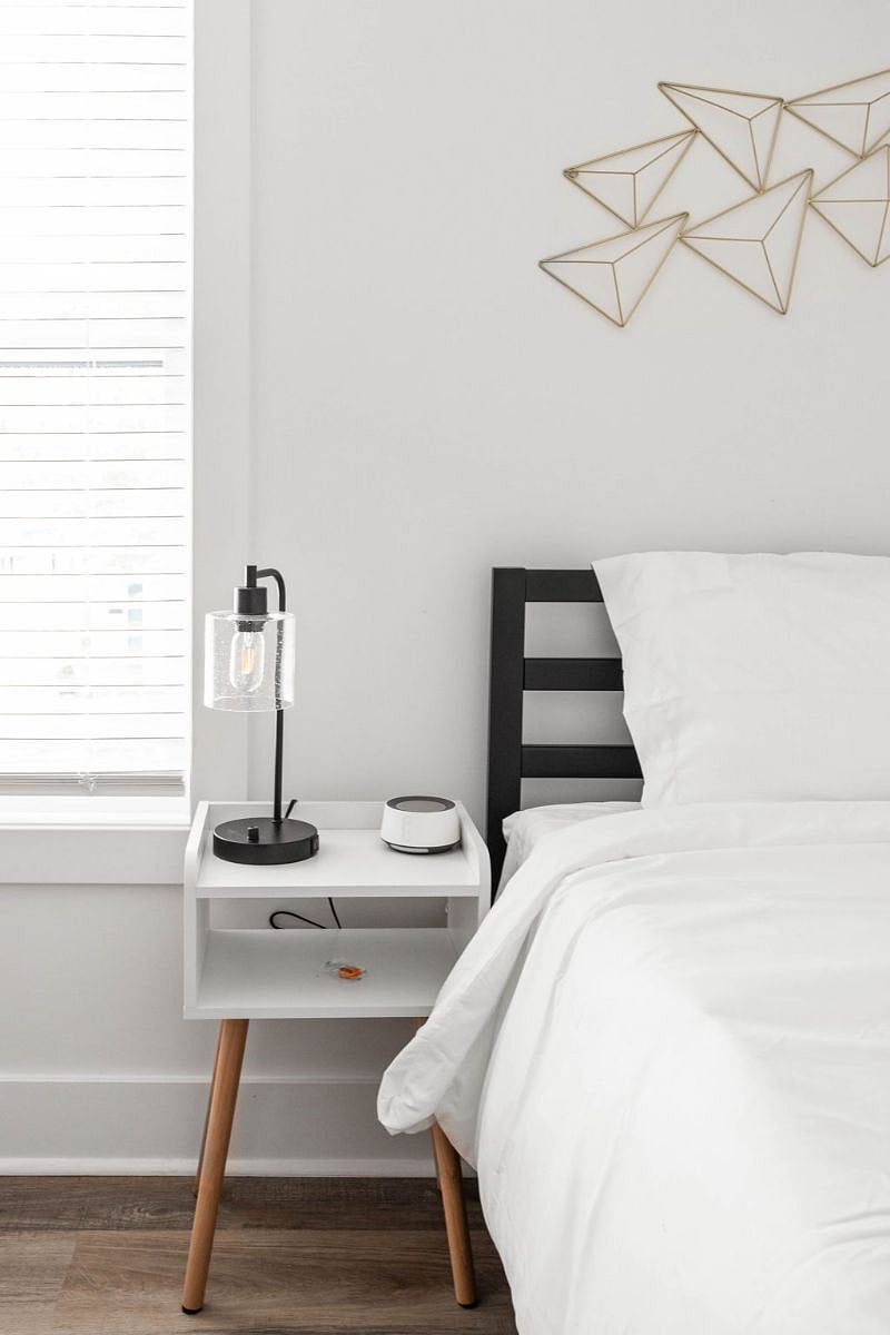 Enjoy the coziness of both a double and a single bed, complete with a bedside table and lamp. Entertainment is at your fingertips with a TV, and the room is illuminated by a window for a delightful stay.