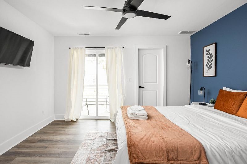 There is an ample amount of natural light filling the space, along with a TV for your entertainment and relaxation.