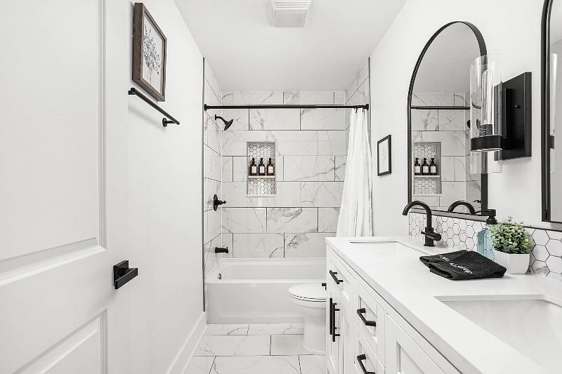 Our luxurious, pristine bathroom, adorned with fresh towels and equipped with all the essential amenities.