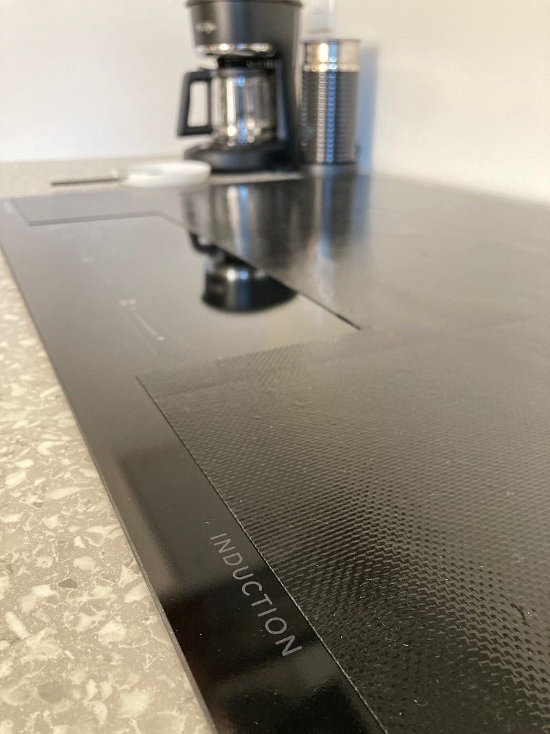 Brand new Frigidaire induction cooktop w/ compatible cookware.