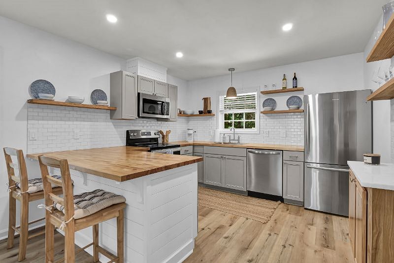 Full kitchen with stainless steel appliances.  
