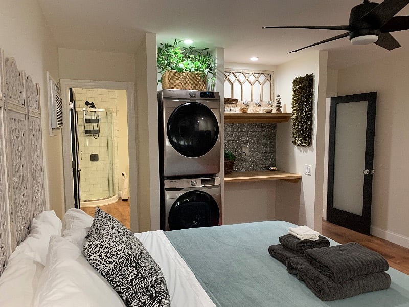 Full Size Washer and Dryer and Laundry Area Looking into First Bathroom