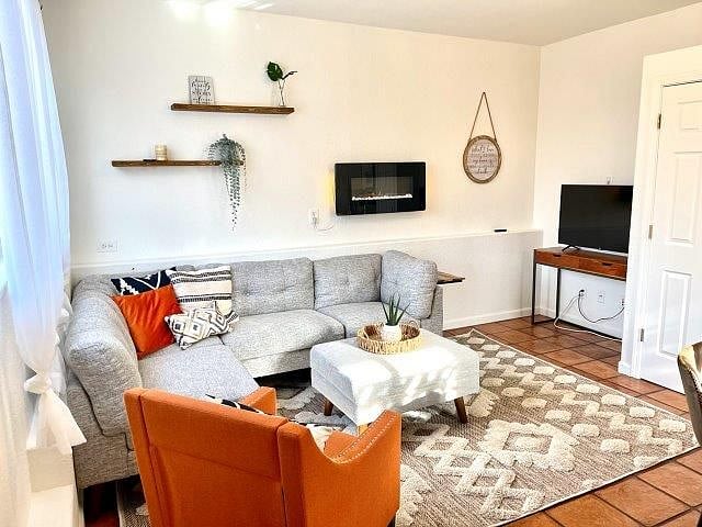 Living area with wall mounted fireplace