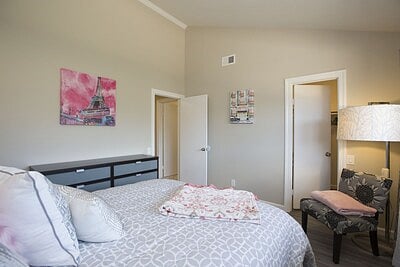 3rd bedroom with queen size bed and a walk in closet