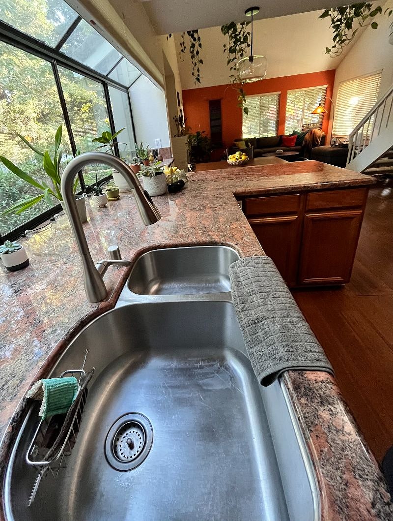 Kitchen Sink w/view of Dining area + Living room