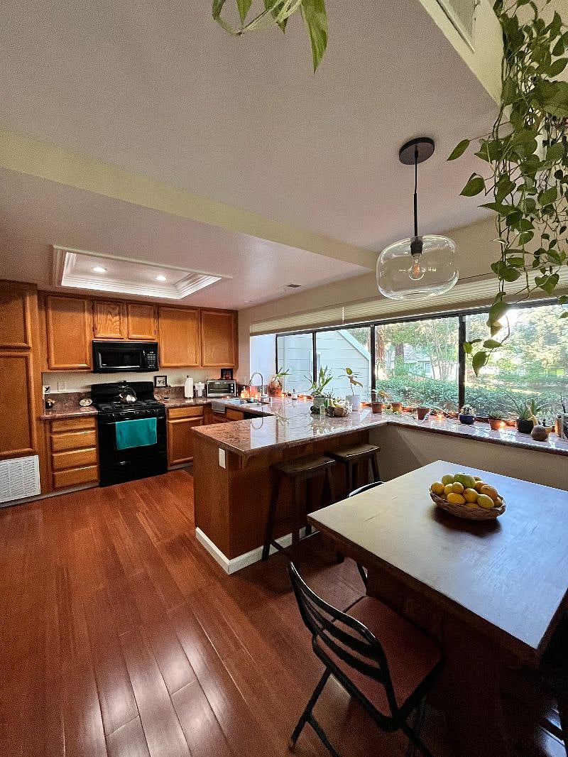Dining table, sitting area + kitchen