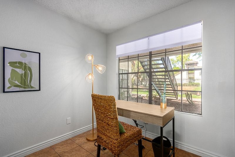 Large window looks out to desert garden
