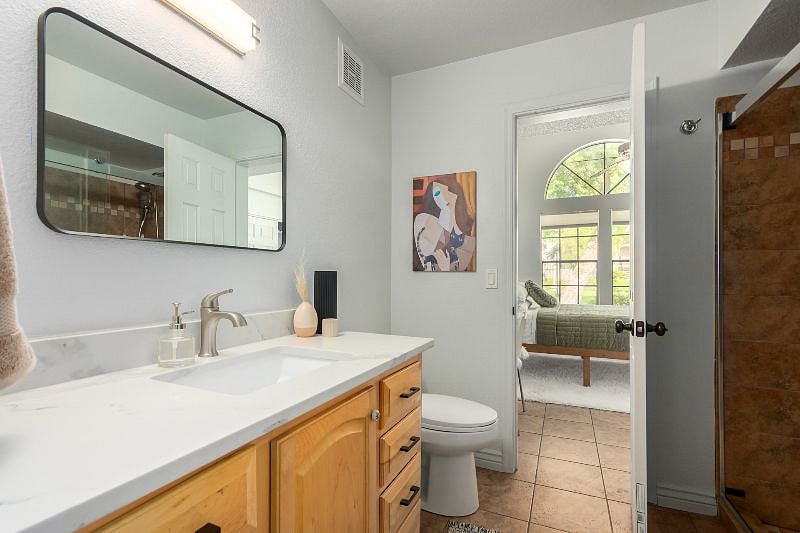 Updated bathroom with private entrance to both bedrooms.