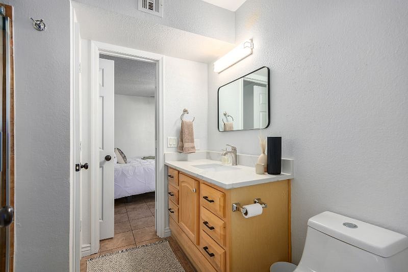 Bright new bathroom with private access to both bedrooms
