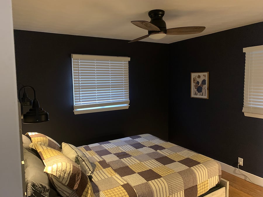 The main bedroom is located off the back of the home and has a window overlooking the back yard.