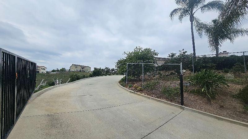 Private gated driveway to the property. The barn is to the left side and our home to the right