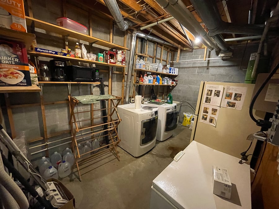 Laundry room , microwave, coffee maker, refrigerator and freezer chest.