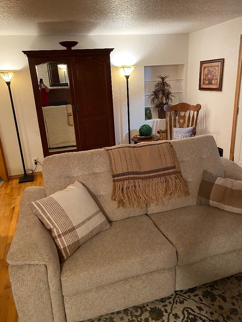 Living room with access to deck. Reclining sofa.