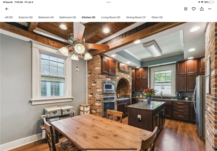 Kitchen with granite countertops and island
