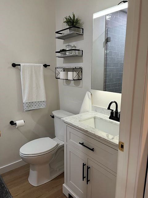 Bathroom vanity includes upper drawer for storage and below sink storage.