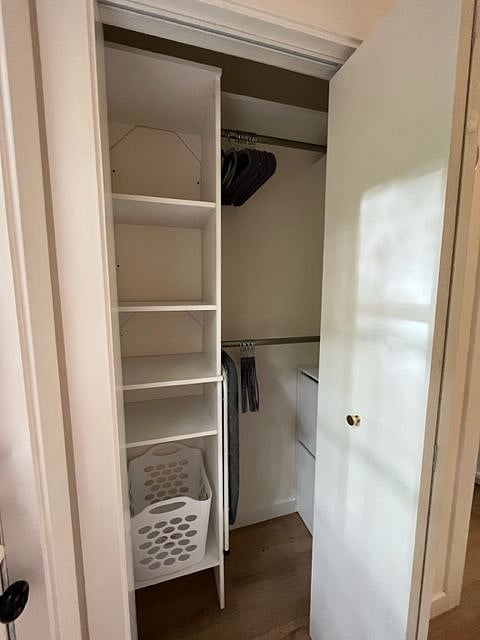Closet has built in storage shelves, rods, and upper shelving space. A double-layered shoe storage cabinet is also included.