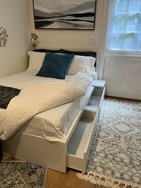 Additional under-bed storage in 2 large rolling drawers.