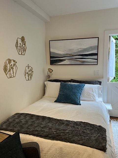 Cozy comfortable, full-sized bed with cotton sheets and down comforter.