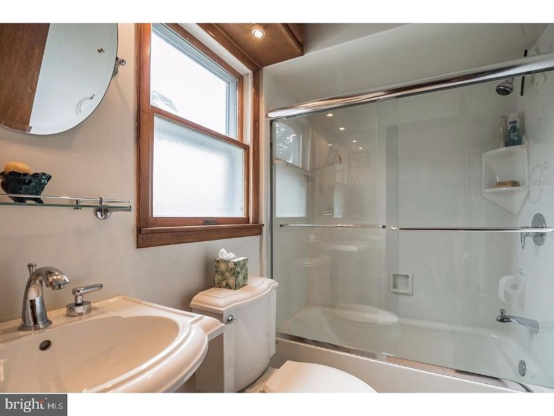Additional full bathroom near garage.