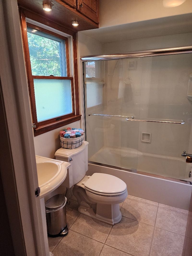 Additional full bathroom near garage.