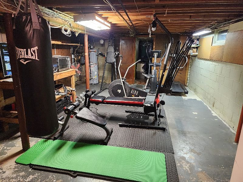 A simple gym with TV is in the basement.