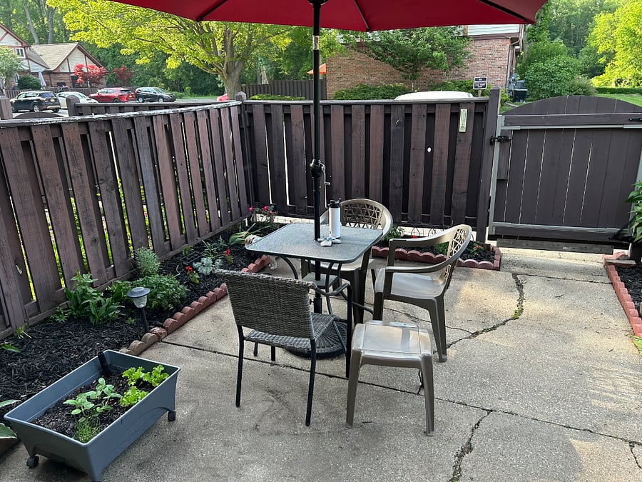 Patio area with a small garden.