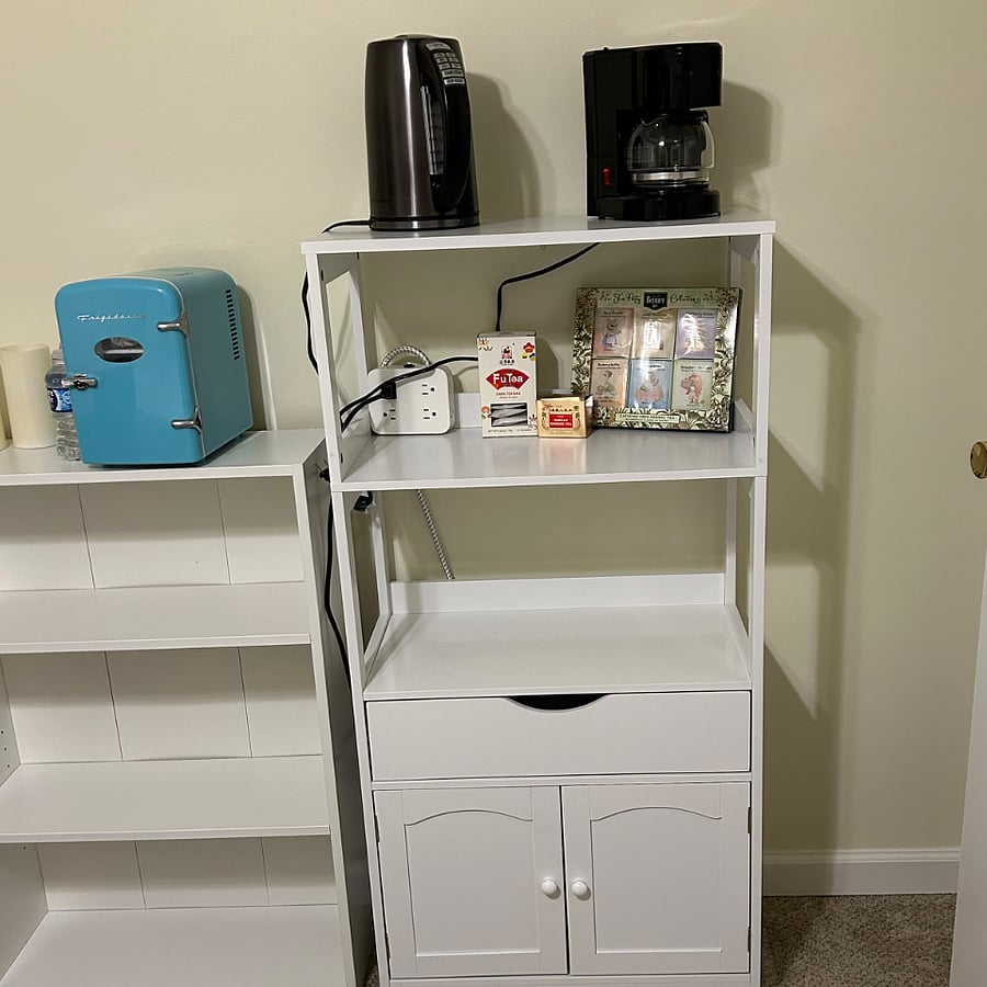 Ive added this little hutch so you can make coffee or tea. And Im putting in a mini fridge for your convenience, but you also have full kitchen privileges.