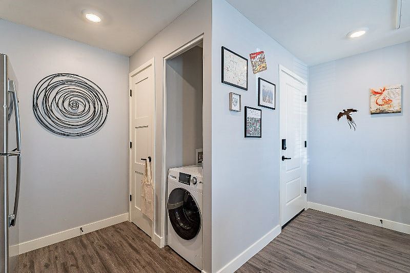 Larger stackable washer and dryer being installed