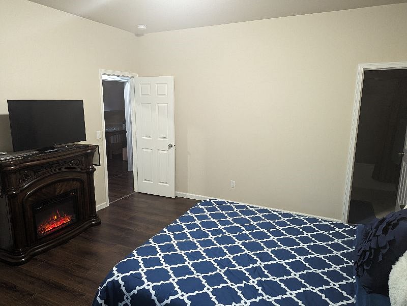 Master bedroom with electric fire place (also has a wall heating unit like all other rooms). Has a queen bed with large double-stacked closet. Smart TV included