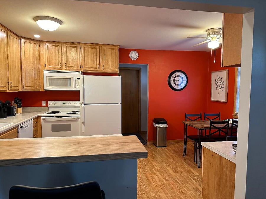 Kitchen dining area and exit to attached garage