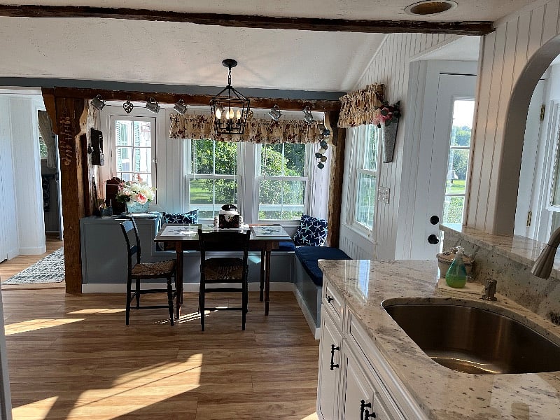 Spacious eat in newly renovated kitchen with large storage pantry and half bath