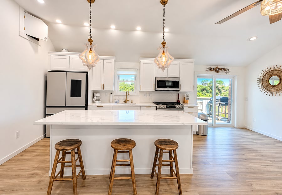 Open floor plan. Kitchen, living room and sliders to side deck and bbq. Modern kitchen with updated smart appliances