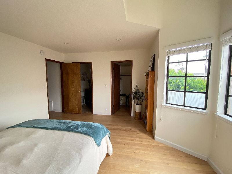 Bedroom 3 - looking from bed to walk-in closet and private bathroom. Door to the hall is on left.