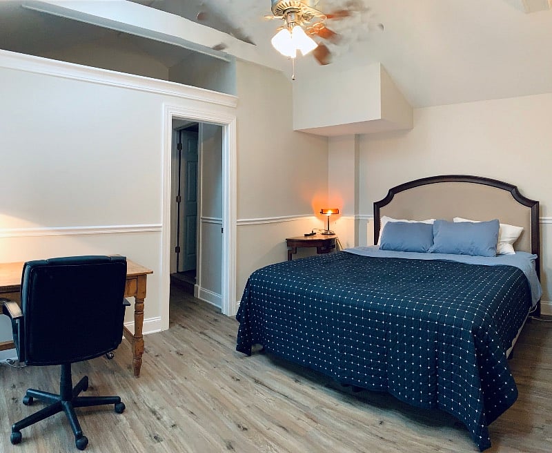 Upstairs lofted bedroom with king bed and work space (tv not pictured behindwhere photo was taken)