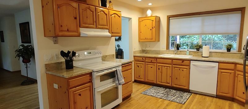 Fully remodeled kitchen with plenty of cupboard and counter space for any chef.