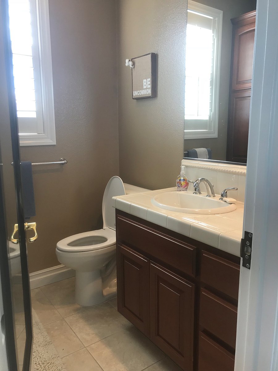 (Cleaning supplies provided next to full size fridge/freezer located downstairs in garage. Wire rack shelving is also designated next to fridge for any dry goods)