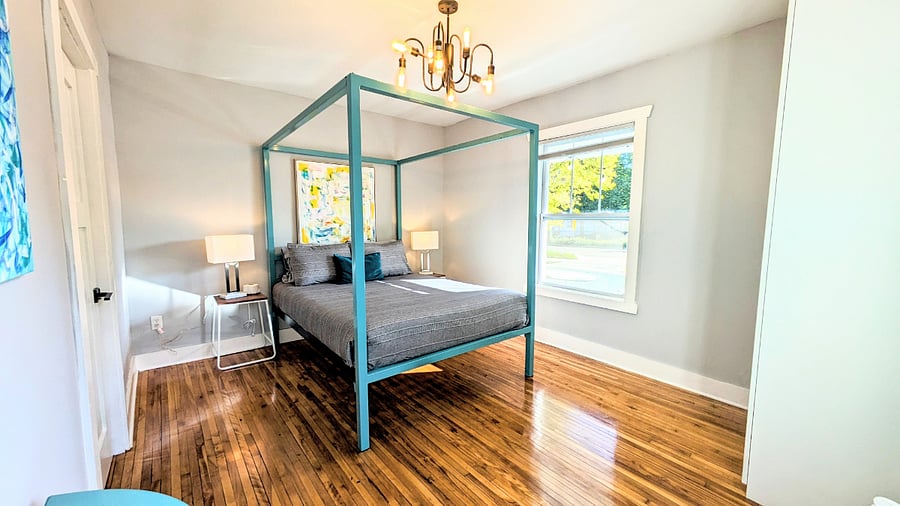 Beautiful wood floors and tons of natural light fill the bedroom
