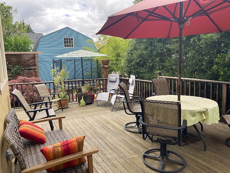 Another eating table and two lounge chairs. BBQ and smoker available as well.