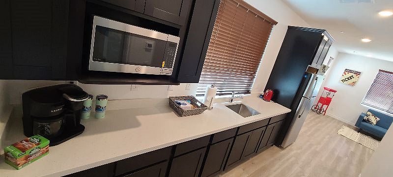 Kitchenette stock with Micro-oven, Keurig coffee maker, electric skillet, hot water kettle & Air Fryer. View