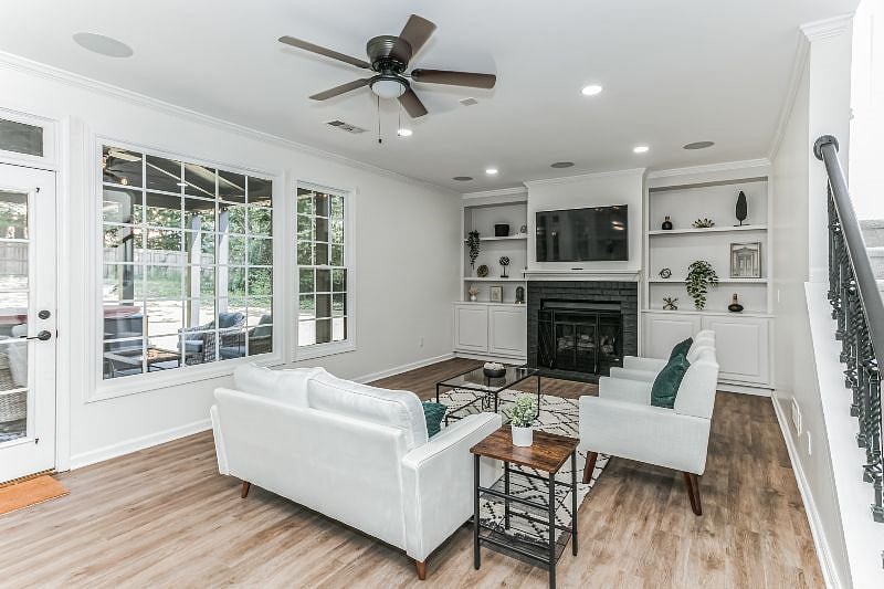 This sitting area has a view of the patio, hot tub and expansive backyard.